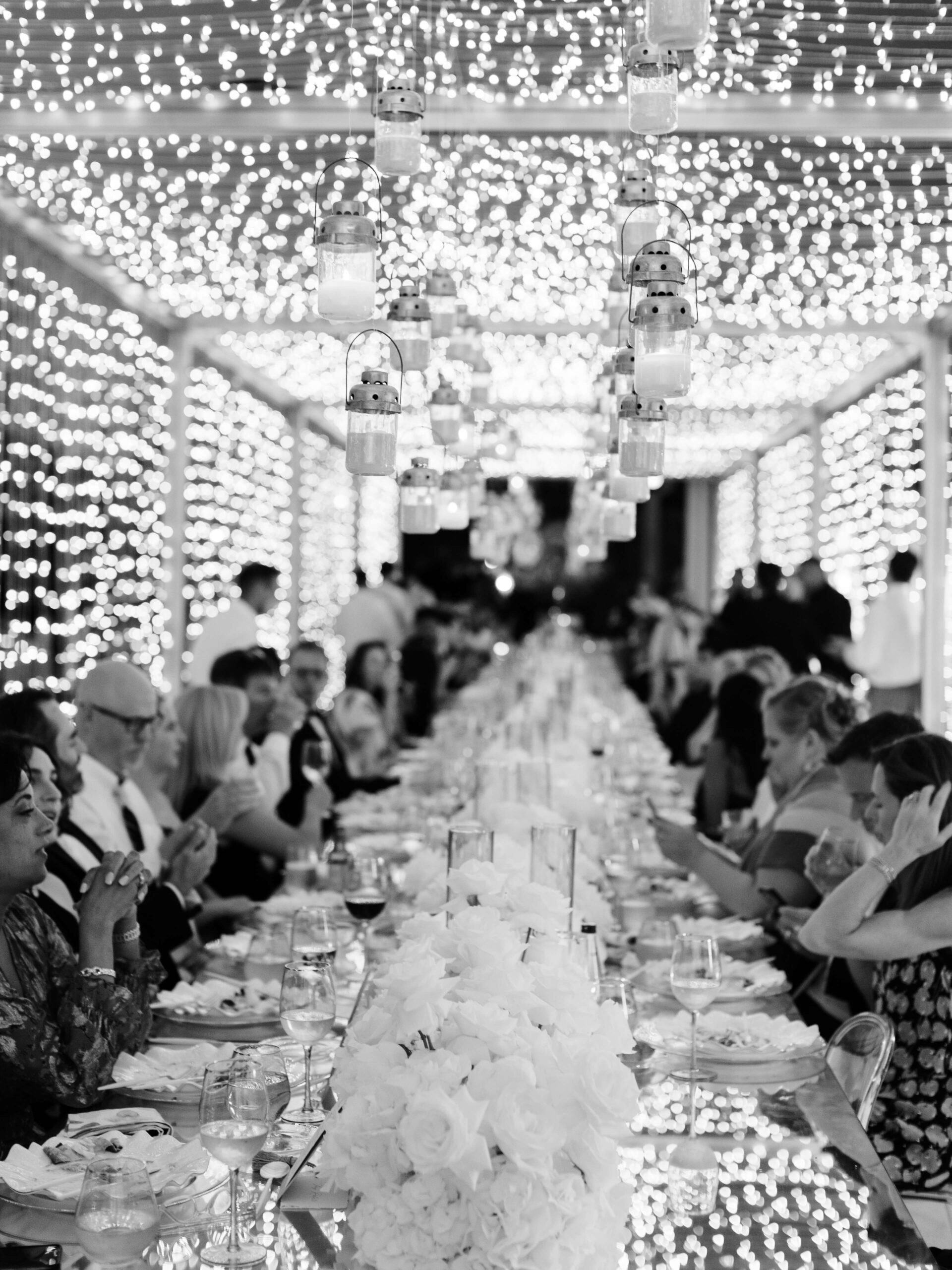 Luxurious White Wedding at Amanzoe - fairy light tunnels