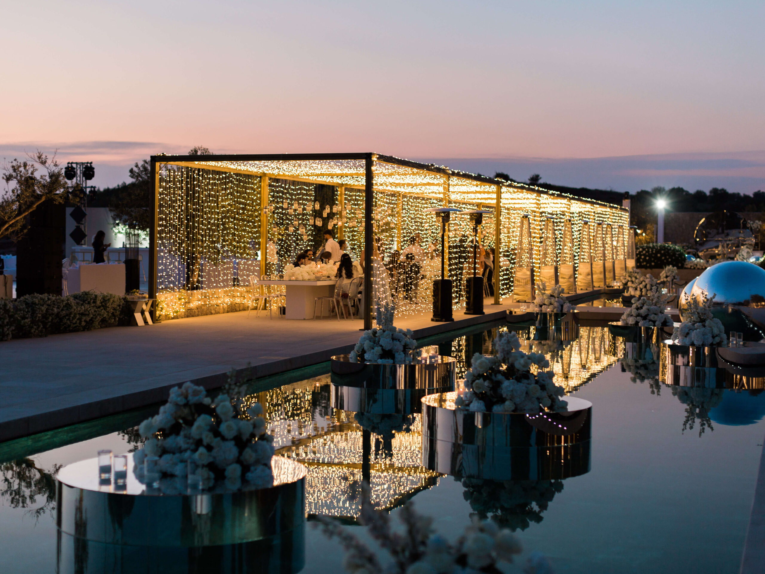 Fairy light tunnels for the wedding reception at Amanzoe